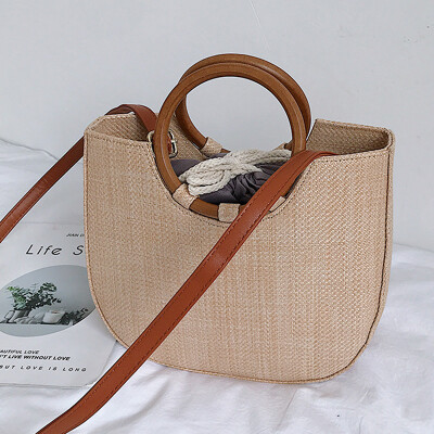 

Spring&summer 2019 new Korean version of the simple straw package round ring wood handle handbag single shoulder spool woven b