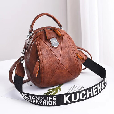 

A girl with a double shoulder bag a broadband shoulder bag a Korean version of a backpack a girl slanted a small round bag and