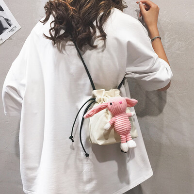 

Bucket bag female 2019 new Korean version of the small fresh girl cute Messenger bag cartoon doll canvas shoulder bag cute