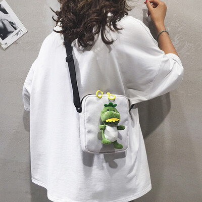 

Cartoon funny small bag female Korean version of the wild cute ugly dinosaur shoulder shoulder Messenger bag foreign girl canvas bag