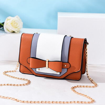 

New macarons contrast color chain handbags sweet girl bow small square bag diagonal shoulder Korean version of the bag