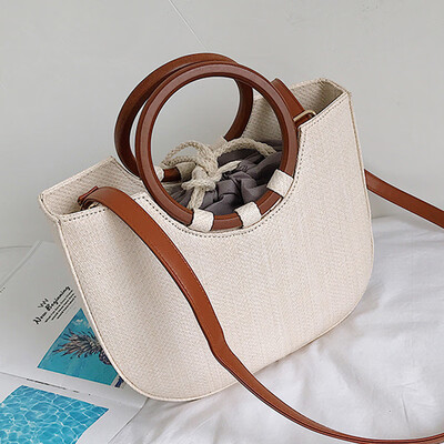 

Spring&summer 2019 new Korean version of the simple straw package round ring wood handle handbag single shoulder spool woven b