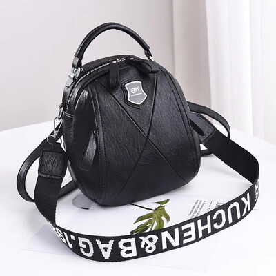 

A girl with a double shoulder bag a broadband shoulder bag a Korean version of a backpack a girl slanted a small round bag and