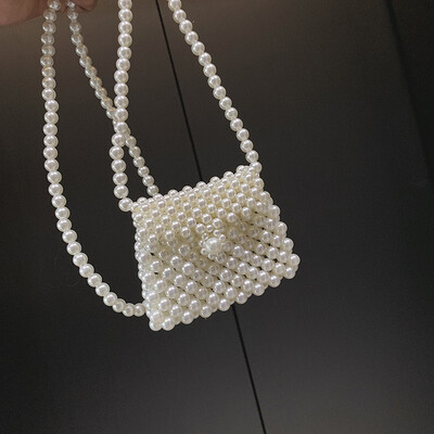 

Qiao Bani 2019 new Korean Bohemian fashion handmade pearls hand strap shoulder diagonal trend handbags