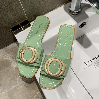 

Korean metal buckle half slippers female Xia 2019 new lazy shoes fashion 100 Korean version of wearing social women slippers