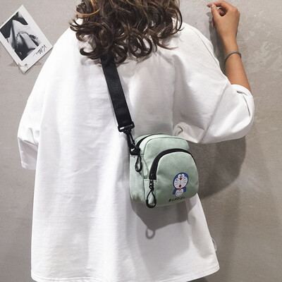 

Cartoon small bag female 2019 new wave Korean fashion wild print girl canvas student shoulder Messenger bag