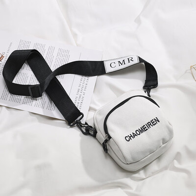 

Ins bag female 2019 new wave casual letter shoulder small round bag Korean version of the simple solid color canvas Messenger bag