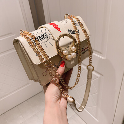 

Qiao Bani 2019 new South Korea ins fashion street shot pearl graffiti flip bag shoulder diagonal trend handbags