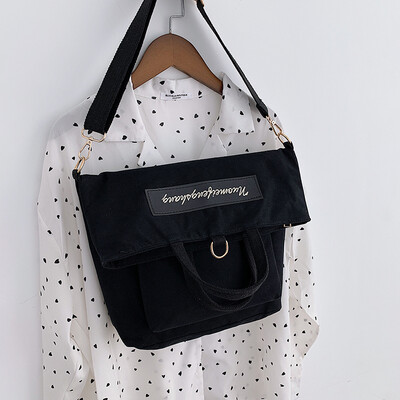 

New casual bag female 2019 new Korean version of the fashion contrast color canvas shoulders versatile shoulder slung tote bag