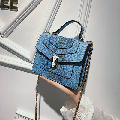

Qiao Bani 2019 new European&American style fashion snake head BV snake pattern flip bag hand strap shoulder diagonal trend handbags