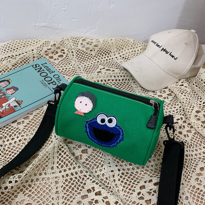 

2019 new cartoon simple versatile shoulder Messenger bag female casual fashion ugly sesame street canvas cylinder bag