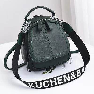 

A girl with a double shoulder bag a broadband shoulder bag a Korean version of a backpack a girl slanted a small round bag and
