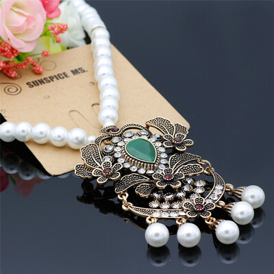 

Новые турецкие женщины полые цветок кулон Strand ожерелье античный золотой цвет смолы бусинка длинный мотаться ожерелье богема рет